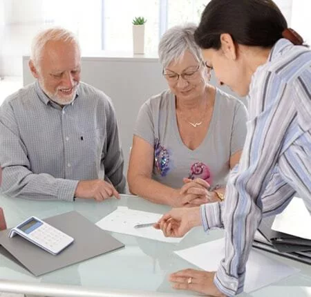 caregiver helping elderly person while waiting for nursing home placement